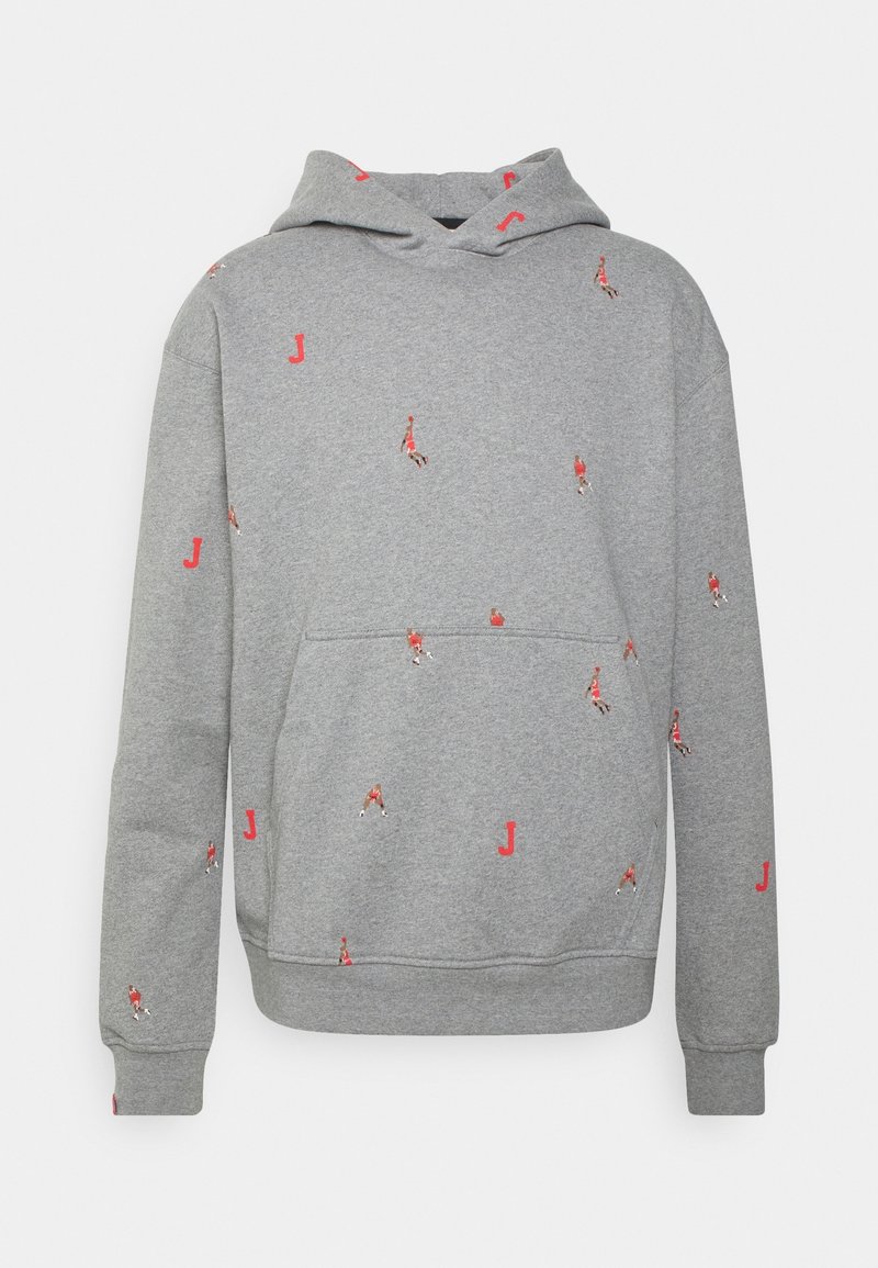 Sweat à capuche gris en tissu doux, avec une poche kangourou. Il présente de petits motifs rouges représentant des figures et des "J" dispersés sur toute la surface.