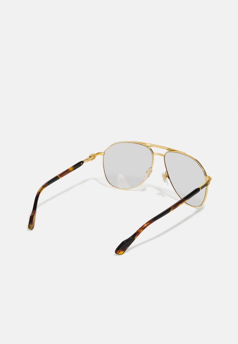 Goldfarbene Metall-Aviator-Sonnenbrille mit grauen Gläsern, die über eine dezente Doppelbrücke und acetatfarbene Bügel im Schildpatt-Muster verfügt.