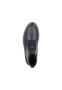 Bottine en cuir noir avec un bout rond, un laçage à l'avant et une semelle texturée. Comprend des détails de couture et une petite boucle à l'arrière.