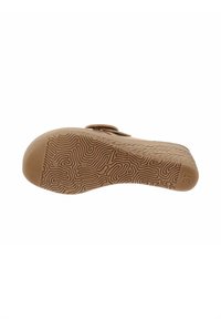 Semelle de chaussure en caoutchouc beige présentant un motif texturé ondulé, une forme arrondie, un léger talon et une indication de taille estampillée "37".