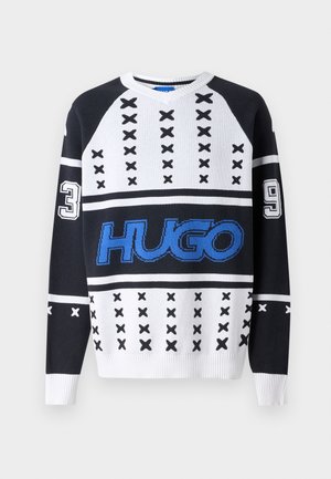 Black and white knitted sweater featuring a v-neck, blue "HUGO" logo, and numeric accents "3" and "9" with cross patterns.