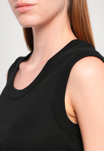 Black, sleeveless top made of soft, stretchy fabric. Features a rounded neckline and clean stitching along the armholes and hem.