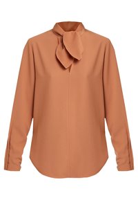 Chemise à manches longues en tissu orange brûlé avec un col montant et un détail de nœud papillon au niveau du cou. Présente une coupe droite et un ourlet arrondi.