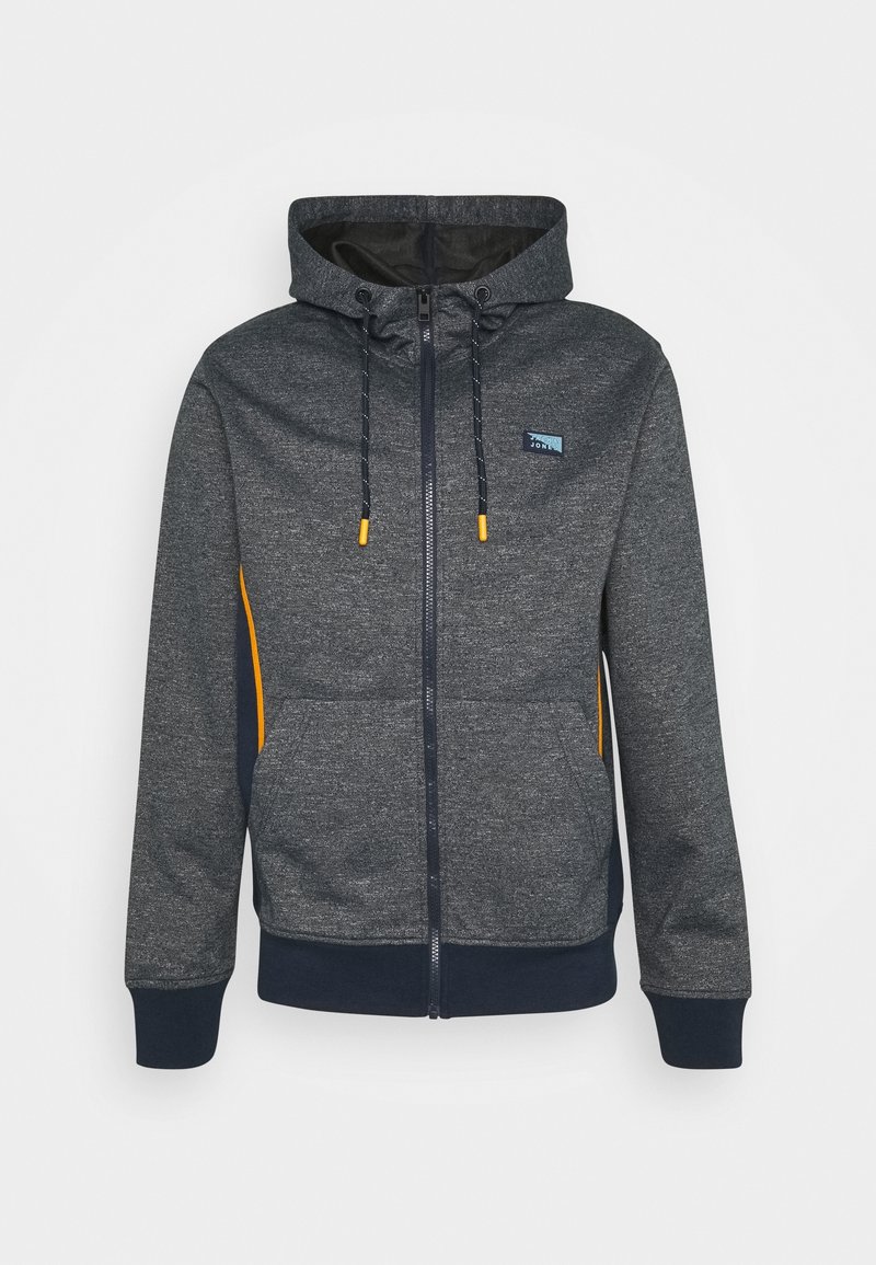 Mörkgrå zip-up hoodie med framfickor, dragsko i huvan med gula spetsar, och liten blå logotyp på vänster bröst.