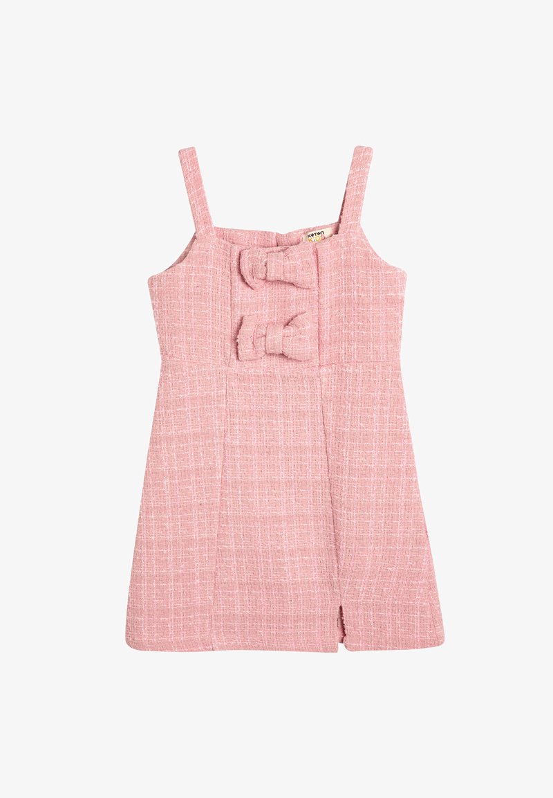 Robe sans manches rose avec un tissu texturé, dotée de deux nœuds décoratifs à l'avant et d'une légère ouverture à l'ourlet.