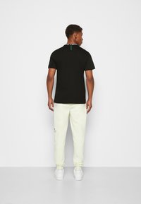 Lacoste T-shirt med print - noir
