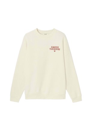 Sweat-shirt à manches longues de couleur crème avec texte rouge « AMOUR TOUJOURS » et un petit cœur sur la poitrine gauche, col rond.