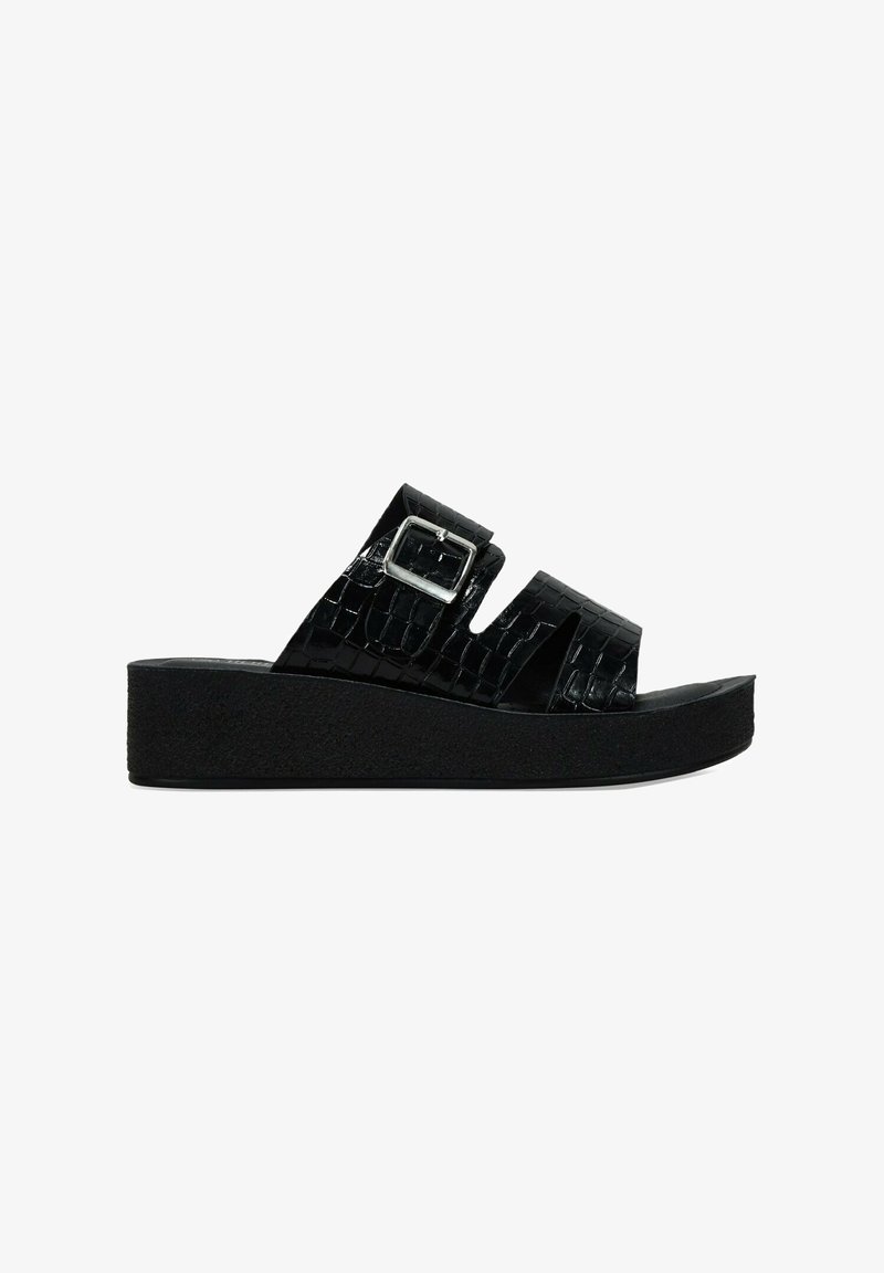 Black platform sandals featuring two wide straps with a crocodile texture and a silver buckle. The sole is textured for grip.