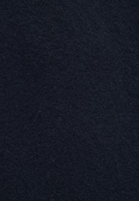 Dark navy wool fabric with a soft, textured surface. The material exhibits a fine, fuzzy appearance with consistent color.