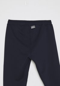 Navyblauwe stretchleggings gemaakt van een gladde, lichte stof met een elastische tailleband en logodetail bij de bovenkant.