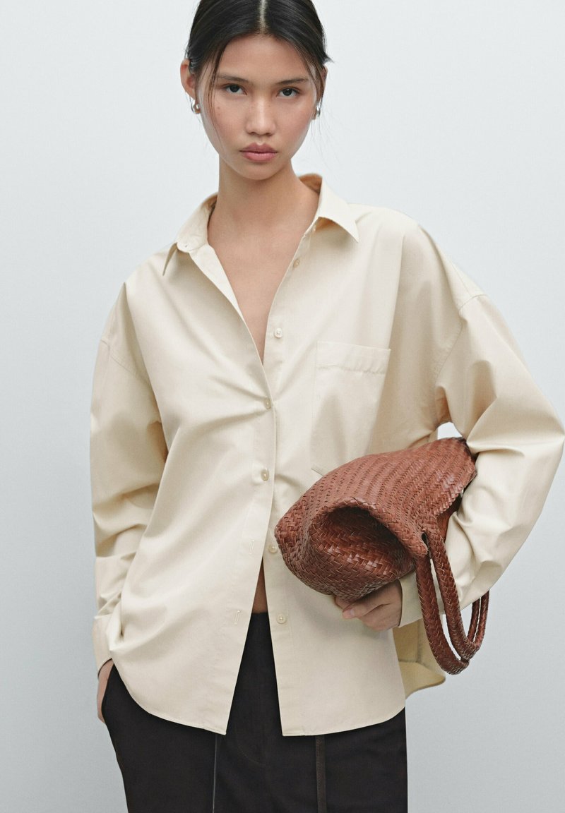 Button down Boubu in a deep brown with dashes of green.