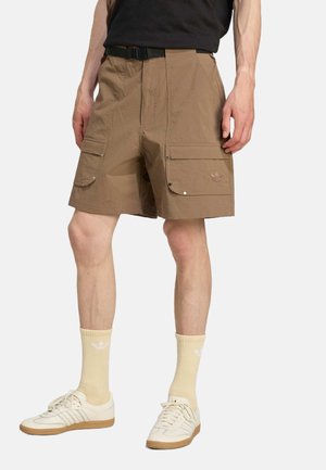 Tan cargo shorts with multiple side pockets, a belt, and a subtle logo accent. Made of lightweight fabric, featuring a relaxed fit.