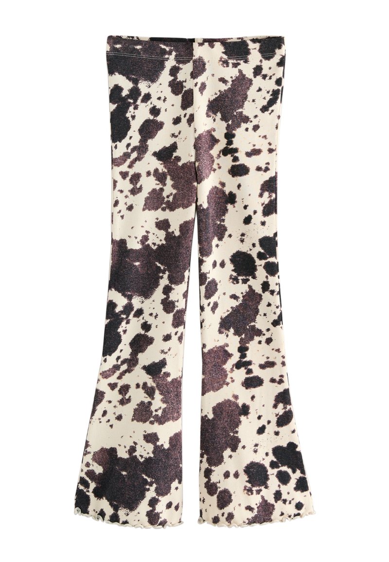 Flared leggings in a beige fabric featuring a black and brown splatter pattern. Ribbed texture with scalloped hem details.
