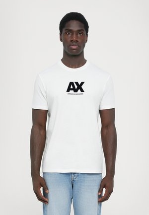 White cotton t-shirt featuring a round neckline and short sleeves, with a bold black "AX" and "ARMANI EXCHANGE" logo on the front.
