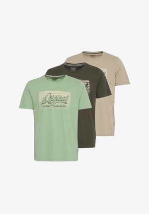Three T-shirts in green, dark olive, and beige. Each has a crew neck and a front graphic with "Original" text and stripes.