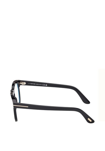 Lunettes en plastique noir avec une monture carrée, dotées de verres bleus, d'accents métalliques sur les branches et d'une surface texturée.