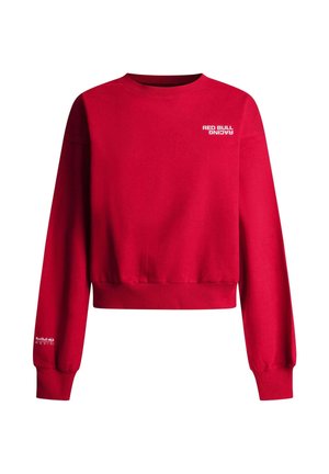 Sweatshirt rouge court en coton rouge vif, doté d'un col ras-du-cou côtelé et de manches longues. Logo "Red Bull Racing" imprimé en blanc.
