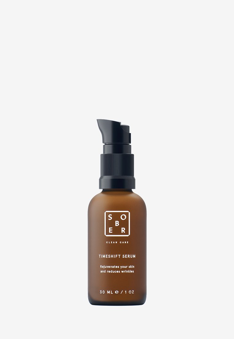 Brown glass bottle with black pump labeled "Sober Clean Care TimeShift Serum" for skin rejuvenation and wrinkle reduction, 30 ml.