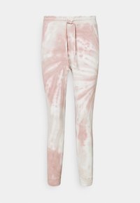 Różowo-kremowe spodnie dresowe w stylu tie-dye z sznurkiem w talii i zwężanymi nogawkami. Wykonane z miękkiego materiału, charakteryzujące się gładką fakturą i elastycznymi mankietami.