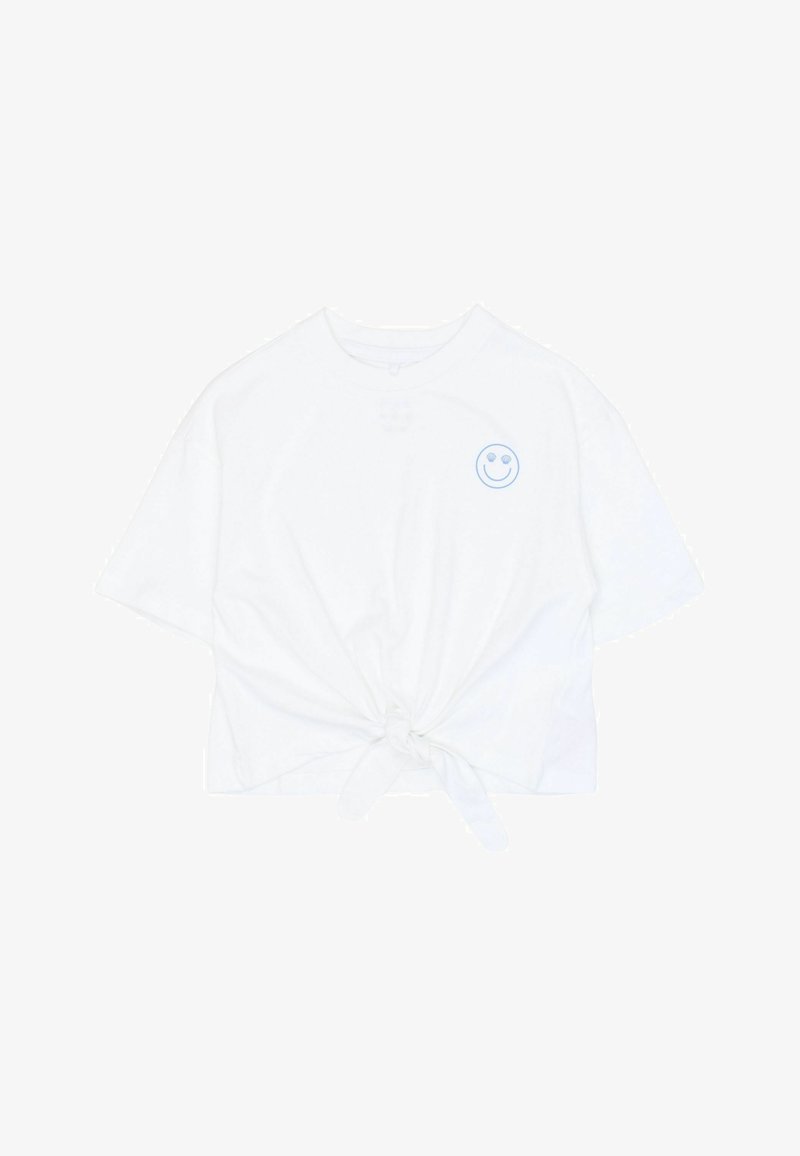 T-shirt blanc en coton à manches courtes, coupe courte, détail nœud à l'avant et broderie d'un smiley bleu sur le haut gauche de la poitrine.