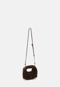Brown faux fur handbag with a rounded shape, featuring a short handle and a detachable leather shoulder strap. Gold hardware accents.