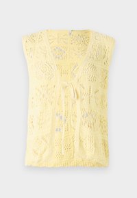 Keltainen neulottu hihaton liivi, jossa on V-pääntie, solmittava suljenta ja koko pinnan kattava kuvio, jossa on avoin pitsimainen yksityiskohta.