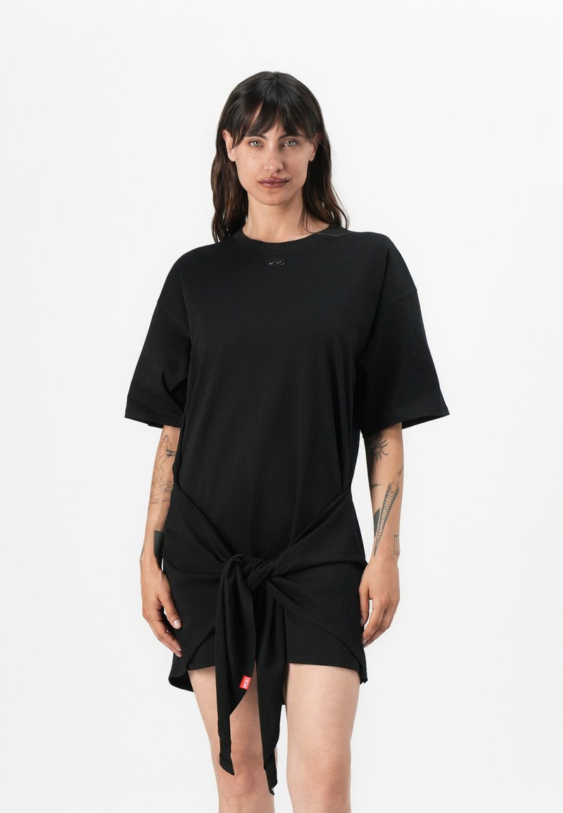 Black short-sleeve dress with a knotted front detail. Made of soft fabric, featuring a round neckline and small logo accent near the neck.