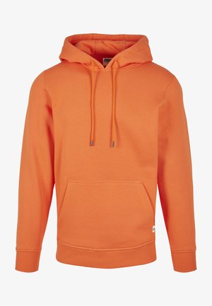 Pomarańczowa bluza z kapturem, wykonana z miękkiego materiału. Posiada przednią kieszeń typu kangur oraz regulowane sznurki. Żebrowane mankiety i dół.