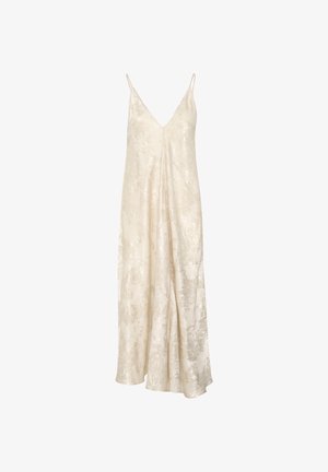 Long, sleeveless cream slip dress with thin straps and subtle shiny textured pattern on fabric.