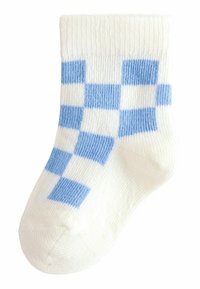 Bomullssocka med vit bas och ett blårutigt mönster, ribbad mudd och en slät textur genom hela sockan.