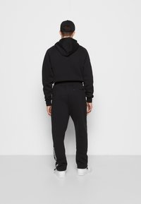 Jordan Träningsbyxor - black