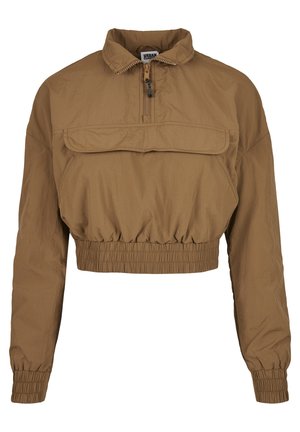 Barna, rövid fazonú kabát, könnyű anyagból készült, álló gallérral, cipzáras záródással, elülső zsebével, valamint elasztikus alsó résszel és mandzsettákkal.