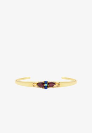 Bracelet manchette en or avec deux pierres rouges en forme de goutte, petite perle turquoise et accents carrés bleus au centre.