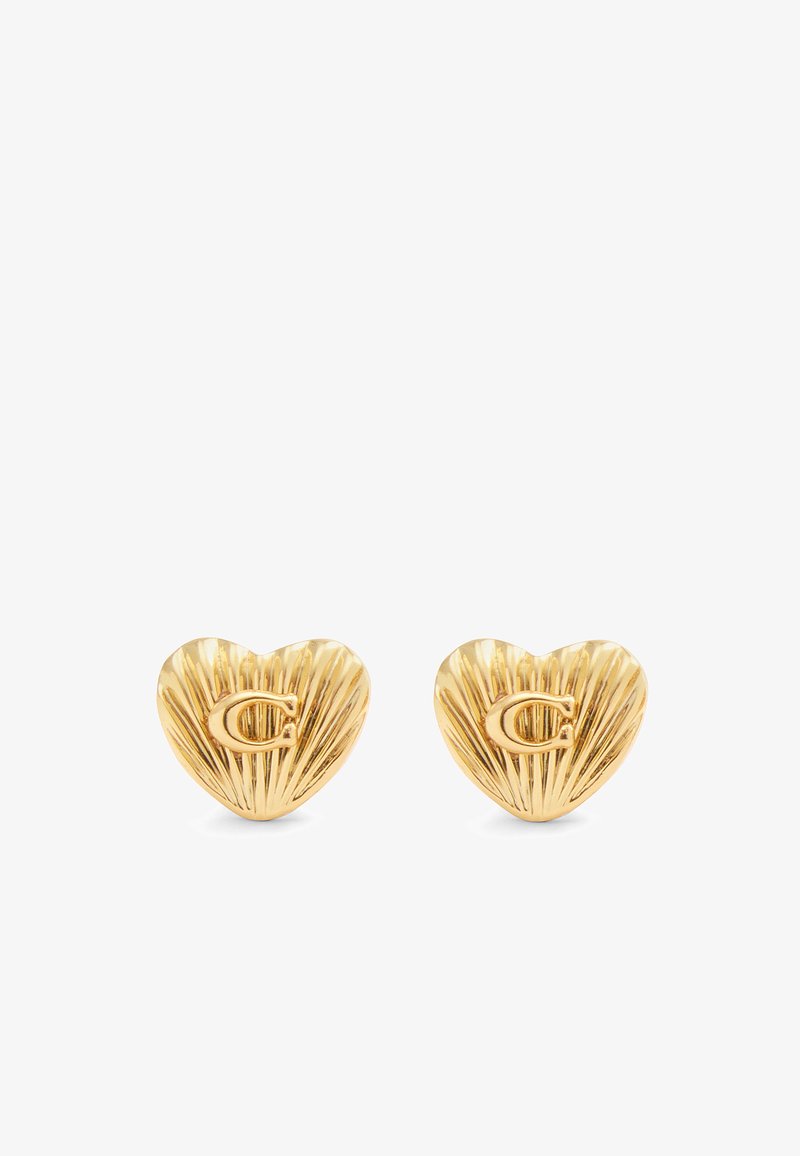 Gold heart-shaped earrings with ribbed texture and embossed "C" logo on each. Small, lightweight design suitable for everyday wear.