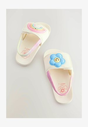 Bērnu slaidās čības krēmkrāsā, ar varavīksnes un ziedu dizainu ar ziliem akcentiem. Mīksts materiāls un regulējami siksniņas komfortam.