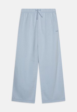 Light blue wide-legged sweatpants with an elastic waistband and drawstring. Features subtle branding on the side. Soft fabric texture.