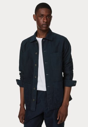 Navy blue jacket made of fabric with a soft texture, featuring a collared neckline, button front, and two large pockets.