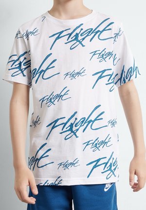 T-shirt en coton blanc avec logo texte "Flight" bleu dans une écriture ludique. Manches courtes, col rond, coupe décontractée, texture lisse.