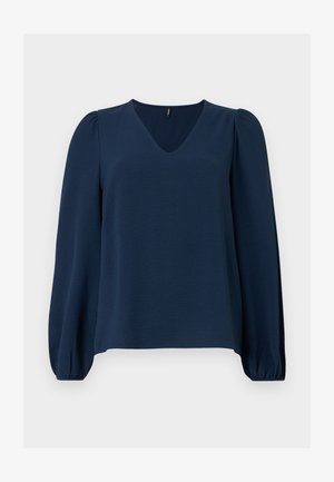 Μπλούζα σε σκούρο μπλε ναυτικό χρώμα με μακριά μανίκια, V-λαιμόκοψη, ελαφρώς φουσκωτούς ώμους και ελαστικές μανσέτες στα μανίκια σε απλό φόντο.