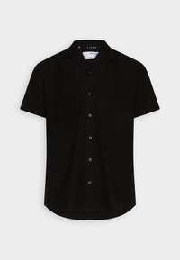 Chemise noire à manches courtes en lin, avec un col pointu, un ourlet arrondi et six boutons noirs sur le devant.