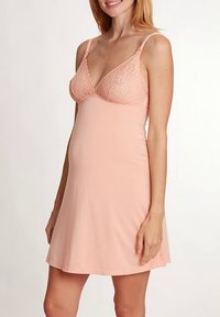 Light pink maternity nightgown with lace-accented bralette top, soft fabric, A-line shape, adjustable straps, and a knee-length hem.