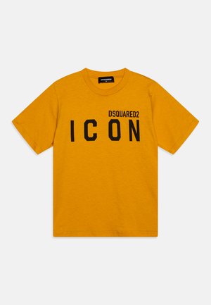 Camiseta de algodón amarilla con cuello redondo, mangas cortas y un estampado negro del logo "ICON" con "DSQUARED2" arriba en letras mayúsculas.
