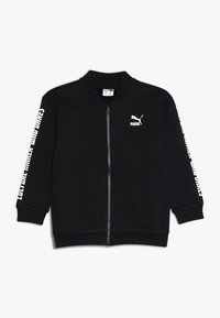 Giacca nera con zip realizzata in tessuto morbido. Presenta polsini a coste e un logo Puma bianco con testo sulle maniche. Design semplice e lineare.
