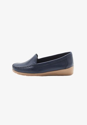 Chaussure bateau en cuir bleu marine avec un design de pointe cousu et une semelle en caoutchouc beige flexible pour le confort et la stabilité.