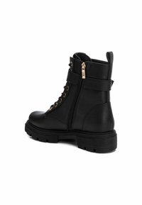 XTI Botines camperos - black