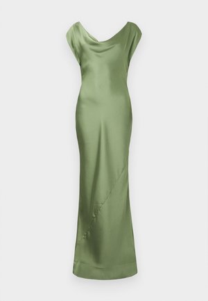 Zaļu satīna kleitu ar drapētu ļaudis kakla izgriezumu, piegrieztiem piedurkņu galiem un pieguļošu siluetu, ar smalku diagonālu šuvju detalizāciju.