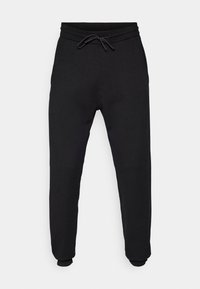 Svarta sweatpants gjorda av mjukt tyg, med en elastisk midja med snörning, mudd vid anklarna och sidofickor.