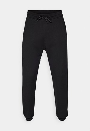 Schwarze Jogginghosen aus weichem Stoff, mit einem elastischen Bund und Kordelzug, Bündchen an den Knöcheln und Seitentaschen.