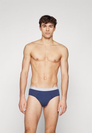 Marineblaue Herrenunterwäsche aus weichem Baumwollstoff, mit einem kontrastierenden grauen Bund und einem glatten, taillierten Design.