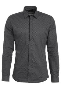 Czarna koszula z długim rękawem z małym białym wzorem w romby, zapinana z przodu na guziki, z kołnierzykiem w końcówkach.